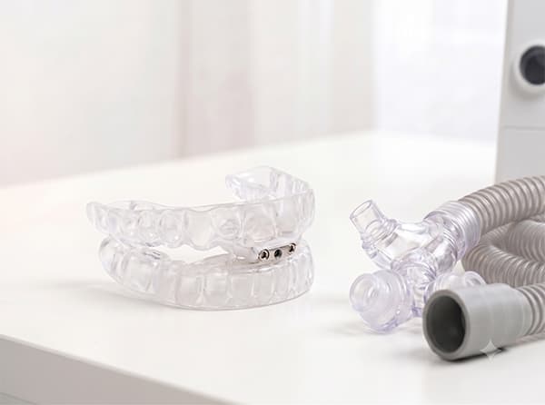 A TAP-PAP interface joining an oral appliance to CPAP nasal pillows