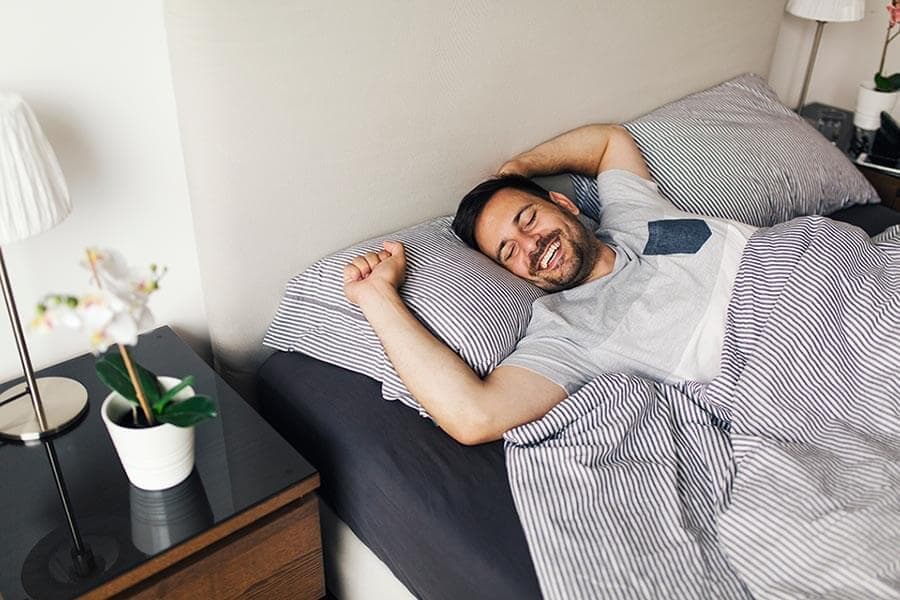 A man sleeping soundly at home